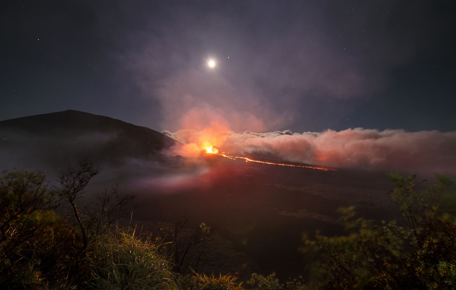 volcano erupting with smoke and lava